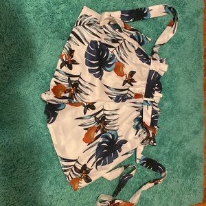 Super cute pair of shorts with a leaf design. Size 2.